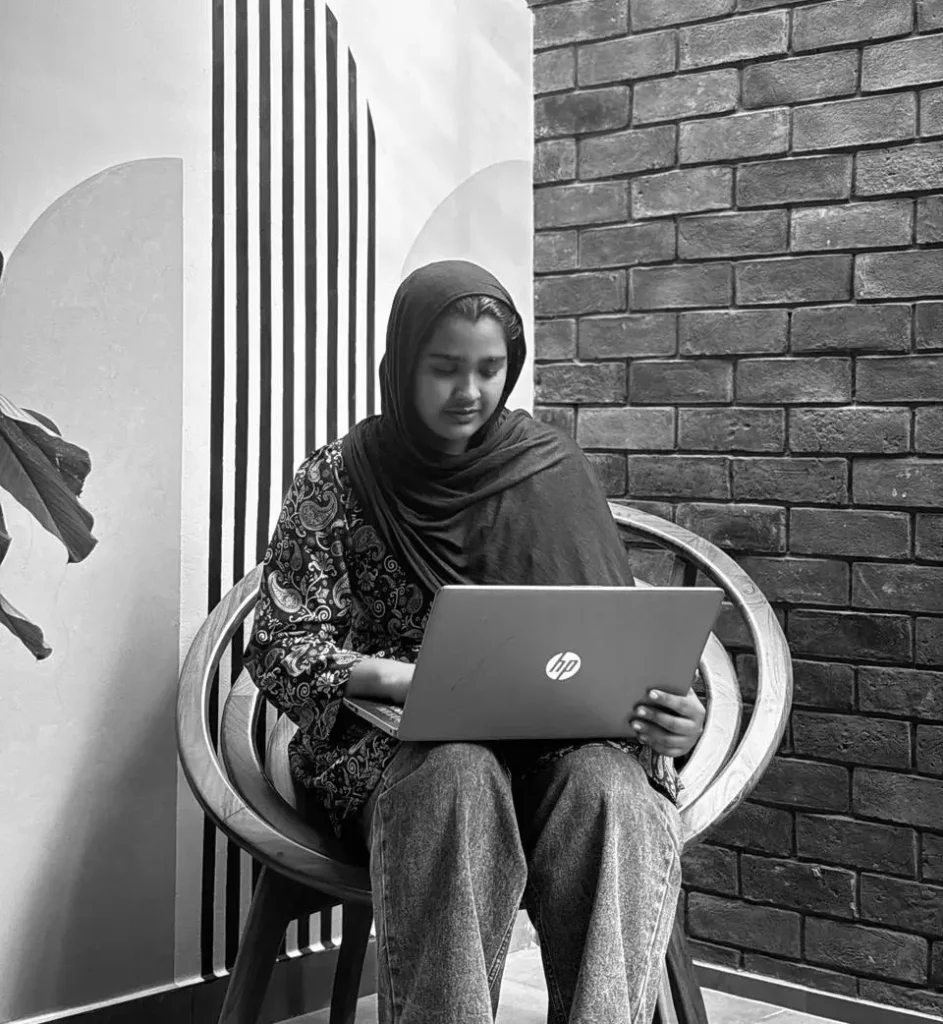 sitting on chair with a laptop, freelance digital marketing analyst in bahrain